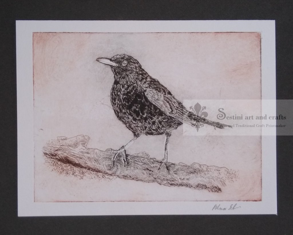 Hand print card of a black bird