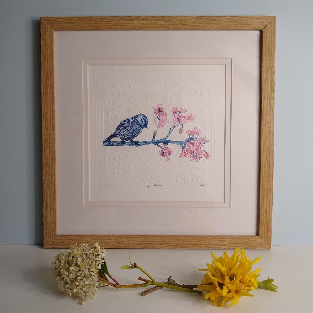 Hand printed embossed bird on branch